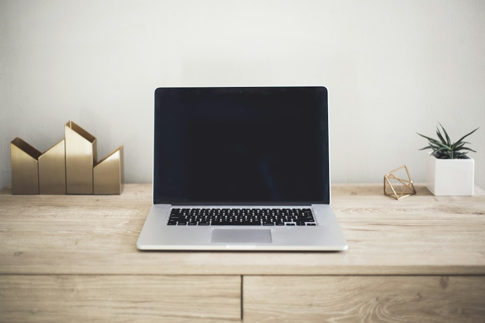 Laptop on a desk / மேசையில் மடிக்கணினி